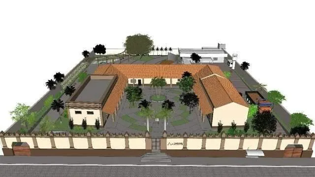 Fachada histórica da Casa do Artesão em restauração com operários e artesãos em frente