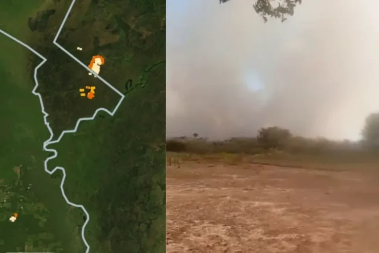 Vista aérea de incêndio no Pantanal avançando e cruzando a fronteira com a Bolívia, com nuvem densa de fumaça e chamas visíveis.