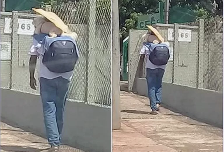 Imagem de homem carregando cachorro nas costas para protegê-lo do calor no asfalto viraliza na internet